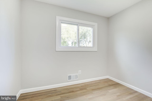 11830 Charles Rd, Silver Spring, MD 20906 - empty room featuring baseboards and light wood-style flooring