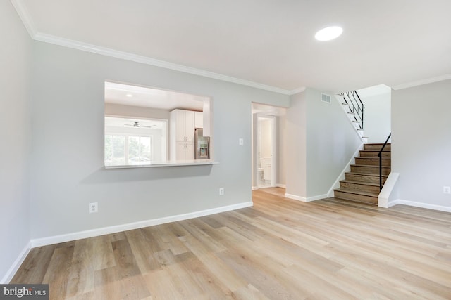 11830 Charles Rd, Silver Spring, MD 20906 - unfurnished living room with stairway, ornamental molding, light wood-style flooring, and baseboards