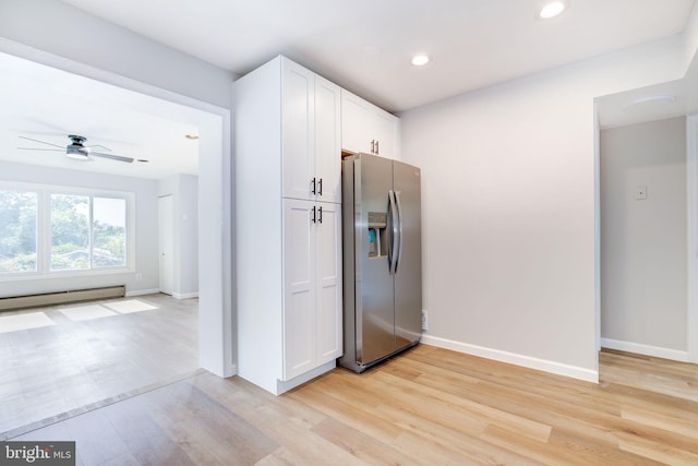 11830 Charles Rd, Silver Spring, MD 20906 - kitchen featuring stainless steel fridge with ice dispenser, baseboard heating, light wood-style flooring, white cabinets, and recessed lighting