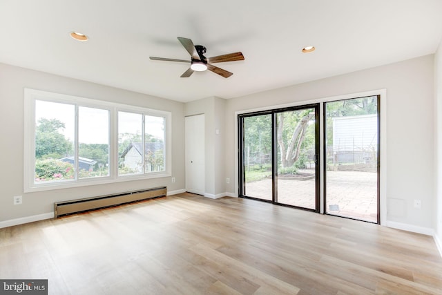 11830 Charles Rd, Silver Spring, MD 20906 - unfurnished room featuring a baseboard heating unit, a ceiling fan, baseboards, light wood-type flooring, and recessed lighting