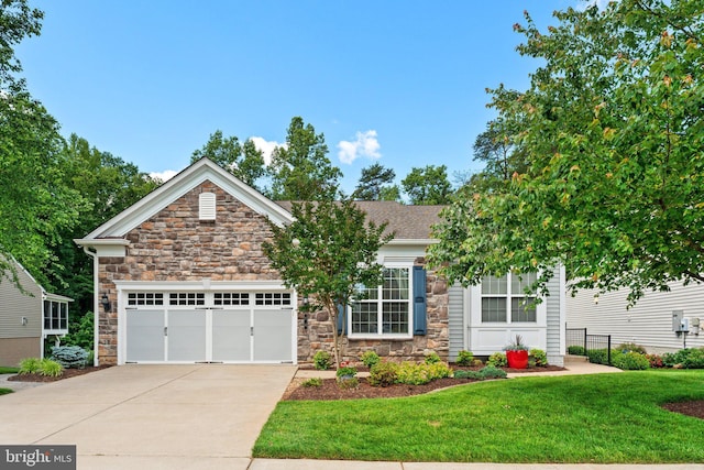 70 Battery Point Dr, Fredericksburg, VA 22406 - view of front of property featuring stone siding, driveway, and an attached garage