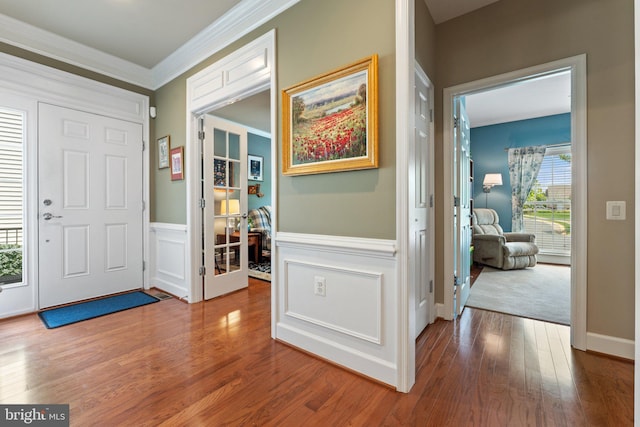 70 Battery Point Dr, Fredericksburg, VA 22406 - entryway with wood finished floors, ornamental molding, a wainscoted wall, and a decorative wall
