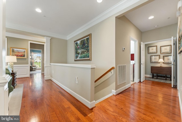 70 Battery Point Dr, Fredericksburg, VA 22406 - hallway with decorative columns, an upstairs landing, light wood-type flooring, ornamental molding, and recessed lighting