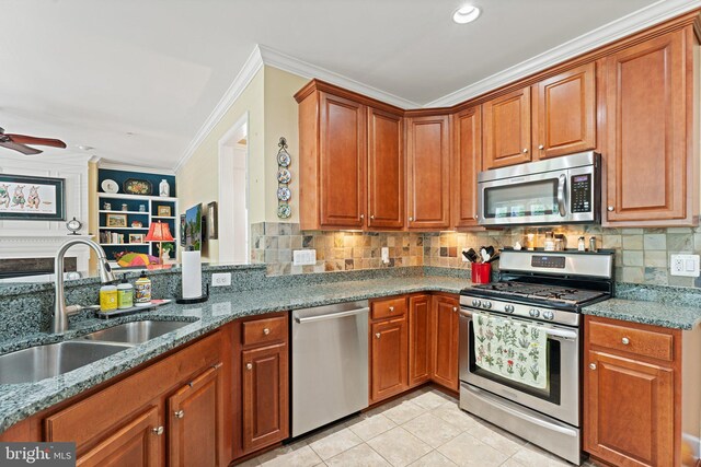 70 Battery Point Dr, Fredericksburg, VA 22406 - kitchen featuring appliances with stainless steel finishes, a sink, a ceiling fan, stone countertops, and ornamental molding