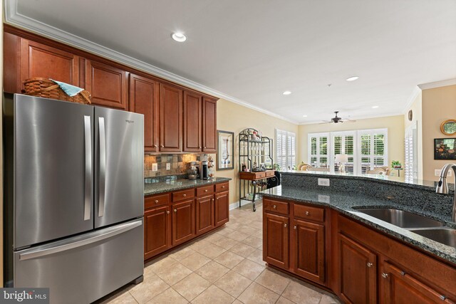 70 Battery Point Dr, Fredericksburg, VA 22406 - kitchen with freestanding refrigerator, a sink, crown molding, light tile patterned flooring, and recessed lighting