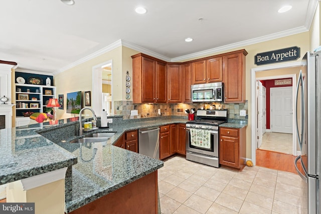 70 Battery Point Dr, Fredericksburg, VA 22406 - kitchen featuring appliances with stainless steel finishes, a sink, ornamental molding, dark stone countertops, and light tile patterned flooring