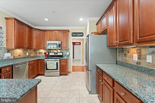 70 Battery Point Dr, Fredericksburg, VA 22406 - kitchen featuring appliances with stainless steel finishes, crown molding, tasteful backsplash, stone counters, and light tile patterned floors