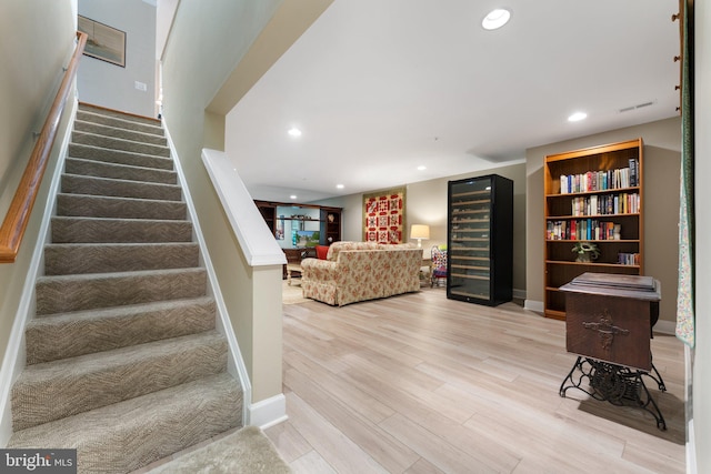 70 Battery Point Dr, Fredericksburg, VA 22406 - stairway featuring beverage cooler, wood finished floors, baseboards, and recessed lighting