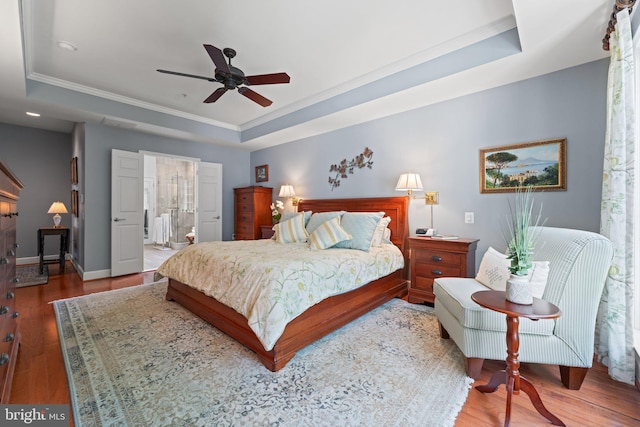 70 Battery Point Dr, Fredericksburg, VA 22406 - bedroom with a tray ceiling, wood finished floors, ornamental molding, baseboards, and connected bathroom