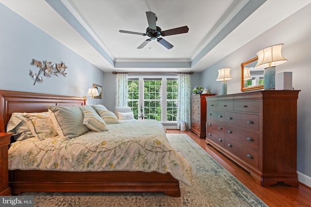 70 Battery Point Dr, Fredericksburg, VA 22406 - bedroom with a tray ceiling, wood finished floors, baseboards, a ceiling fan, and crown molding