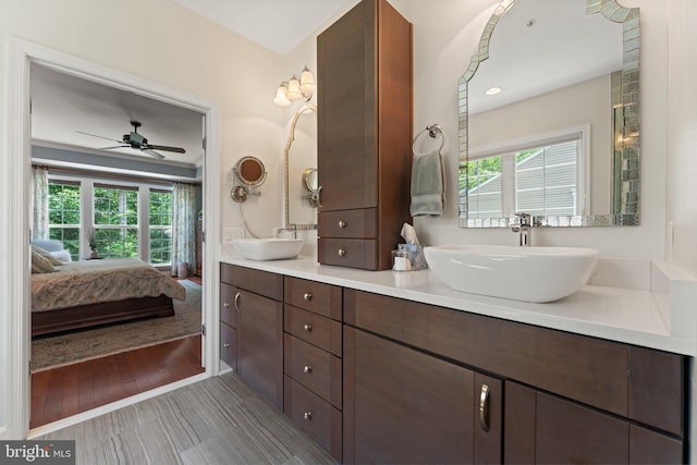 70 Battery Point Dr, Fredericksburg, VA 22406 - ensuite bathroom featuring double vanity, plenty of natural light, a ceiling fan, and wood finished floors