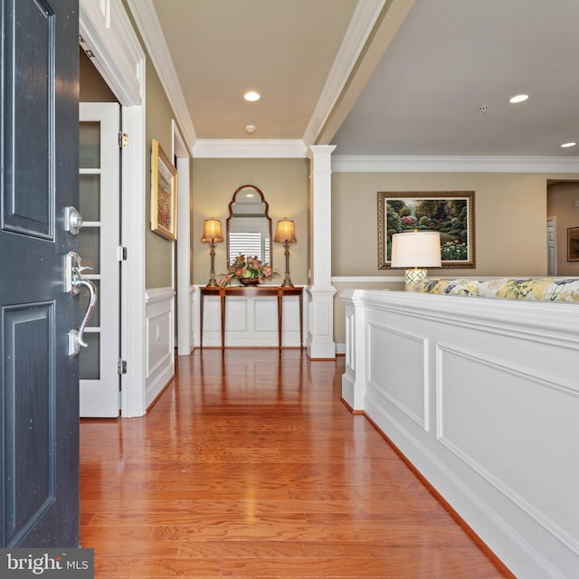 70 Battery Point Dr, Fredericksburg, VA 22406 - corridor featuring crown molding, light wood finished floors, decorative columns, a wainscoted wall, and recessed lighting