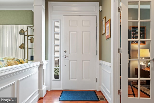 70 Battery Point Dr, Fredericksburg, VA 22406 - entryway with a decorative wall, ornamental molding, wood finished floors, and wainscoting