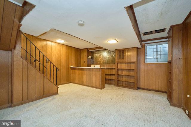 66 Allison St NE, Washington, DC 20011 - bar with wooden walls, stairway, baseboards, and carpet flooring