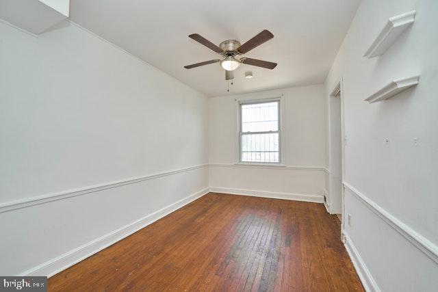 66 Allison St NE, Washington, DC 20011 - unfurnished room with wood-type flooring, ceiling fan, and baseboards