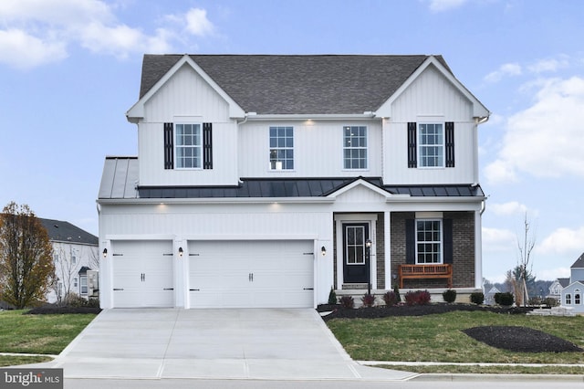 0 Williamson Rd, Winchester, VA 22602 - view of front of property featuring a standing seam roof, a shingled roof, concrete driveway, a porch, and a front lawn