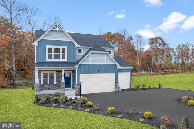 0 Williamson Rd, Winchester, VA 22602 - craftsman-style home featuring a garage, a standing seam roof, a front yard, roof with shingles, and stone siding
