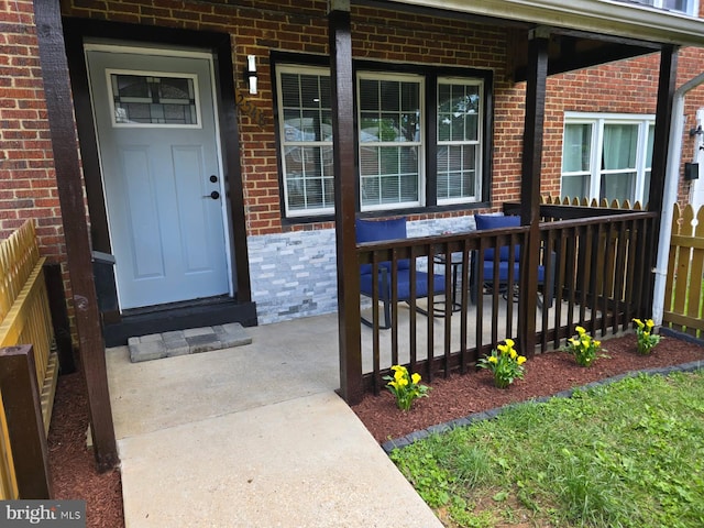 2548 Marbourne Ave, Baltimore, MD 21230 - view of exterior entry with brick siding and a porch