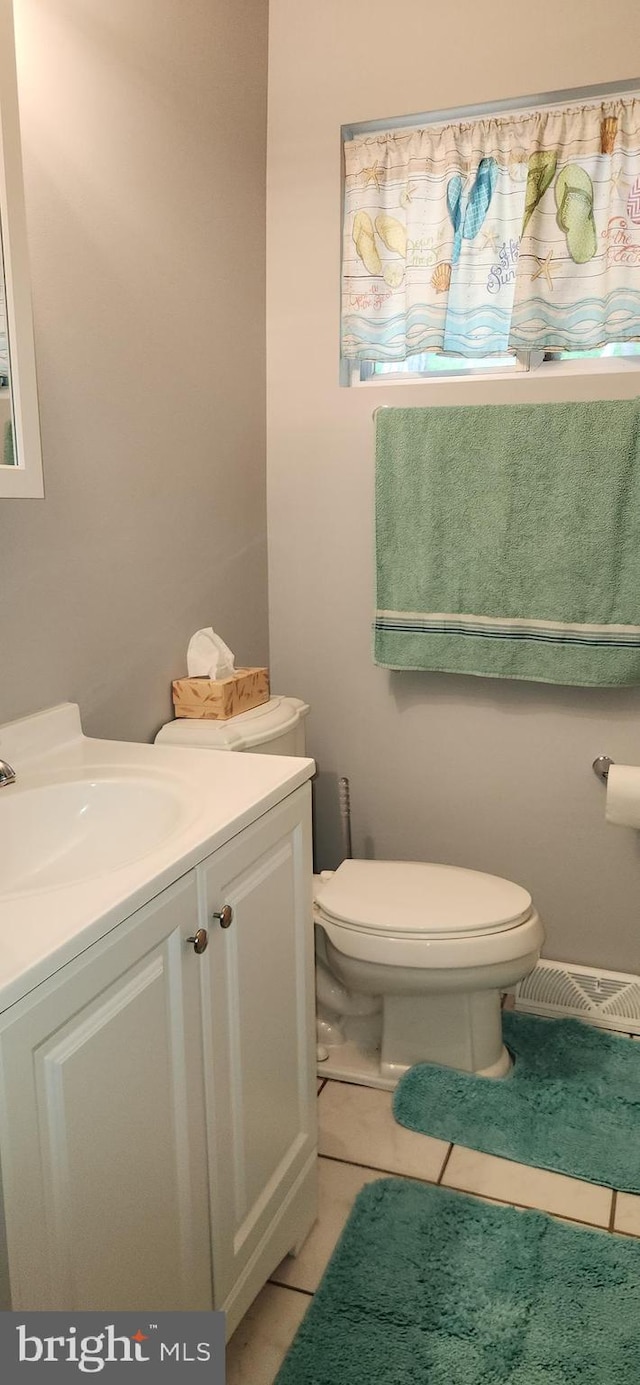 3203 N Lakeshore Dr, Browns Mills, NJ 08015 - half bathroom with vanity, toilet, and tile patterned floors