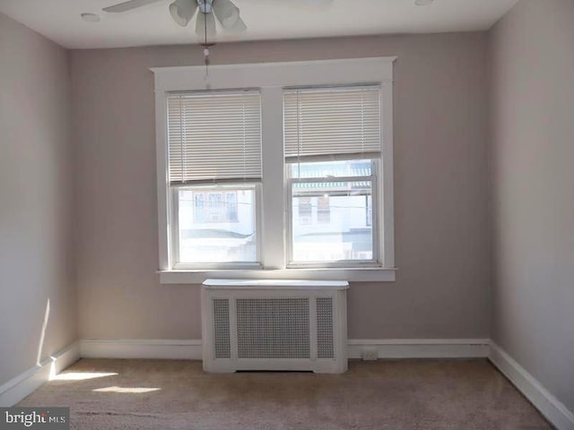 2130 Melvin St, Philadelphia, PA 19131 - carpeted spare room with radiator heating unit, a ceiling fan, and baseboards