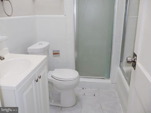2130 Melvin St, Philadelphia, PA 19131 - full bath with toilet, tile walls, vanity, and tile patterned floors