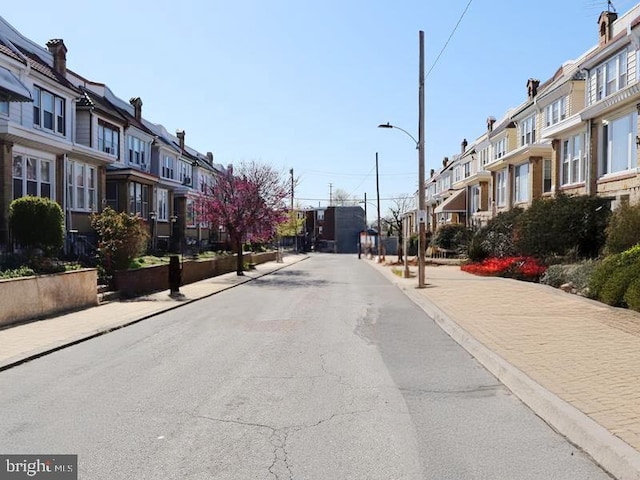 2130 Melvin St, Philadelphia, PA 19131 - view of asphalt street with a residential view, sidewalks, street lights, and curbs
