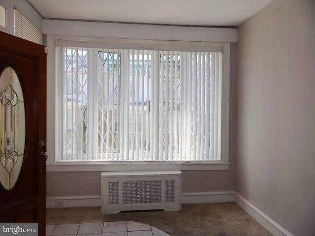2130 Melvin St, Philadelphia, PA 19131 - tiled entrance foyer with radiator heating unit, plenty of natural light, and baseboards