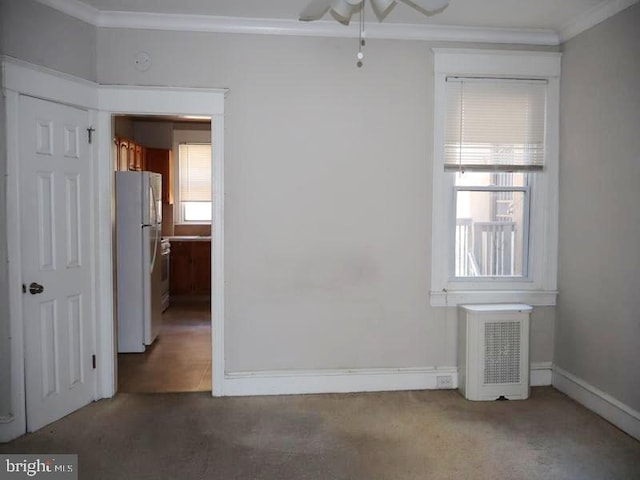 2130 Melvin St, Philadelphia, PA 19131 - carpeted spare room featuring crown molding, radiator heating unit, ceiling fan, and baseboards