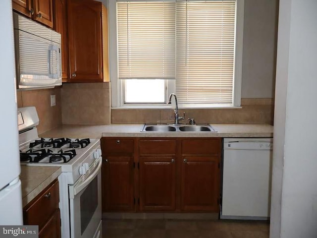 2130 Melvin St, Philadelphia, PA 19131 - kitchen with white appliances, a sink, light countertops, and decorative backsplash