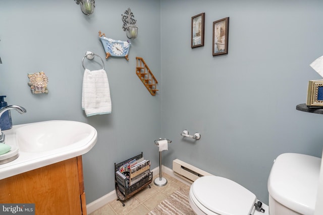 64 Sepulga Dr, Browns Mills, NJ 08015 - bathroom featuring toilet, a baseboard heating unit, tile patterned flooring, baseboards, and vanity