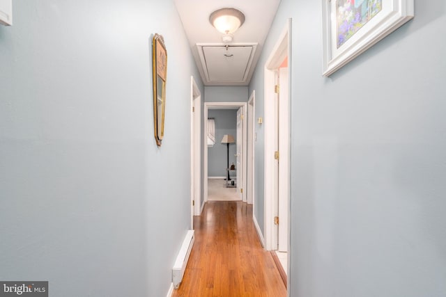 64 Sepulga Dr, Browns Mills, NJ 08015 - hallway with attic access, a baseboard radiator, light wood-type flooring, and baseboards