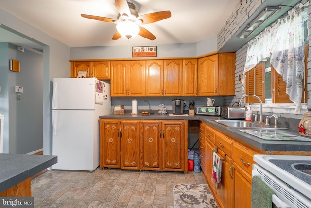 64 Sepulga Dr, Browns Mills, NJ 08015 - kitchen featuring freestanding refrigerator, a sink, brown cabinetry, and dark countertops