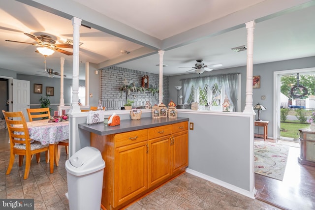 64 Sepulga Dr, Browns Mills, NJ 08015 - kitchen with ornate columns, ceiling fan, dark countertops, and open floor plan