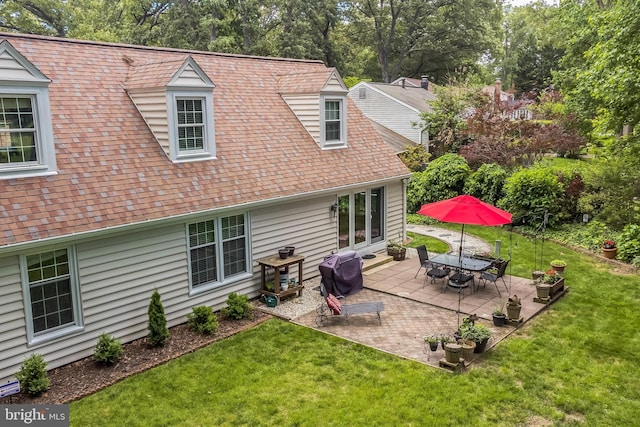 1512 Eton Way, Crofton, MD 21114 - rear view of property featuring a yard, view of scattered trees, a patio, and roof with shingles
