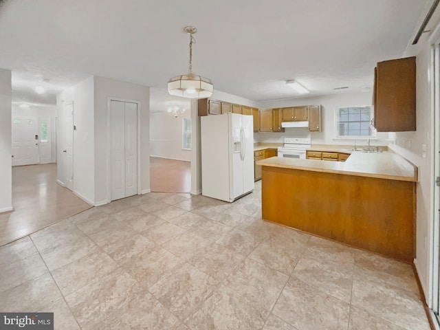 6502 Elk Ct, Waldorf, MD 20603 - kitchen with white appliances, light countertops, a sink, and a peninsula