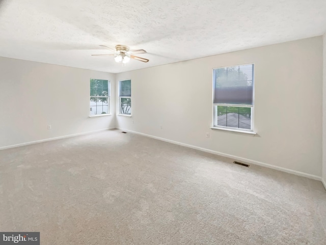 6502 Elk Ct, Waldorf, MD 20603 - carpeted empty room with a ceiling fan, baseboards, and a textured ceiling