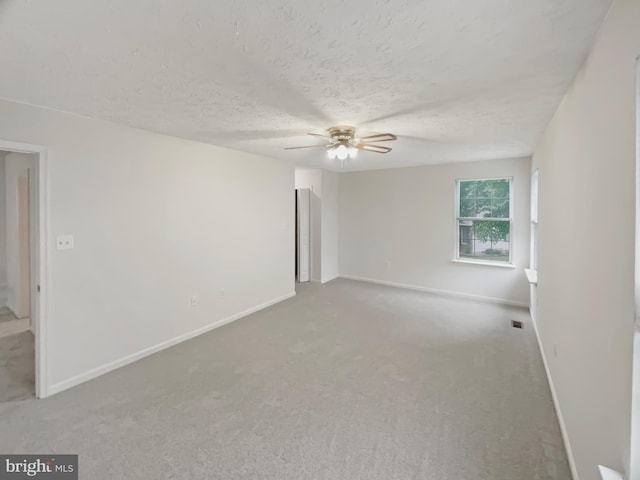 6502 Elk Ct, Waldorf, MD 20603 - carpeted spare room featuring ceiling fan, baseboards, and a textured ceiling