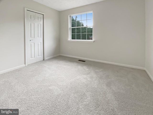 6502 Elk Ct, Waldorf, MD 20603 - unfurnished bedroom with baseboards, a closet, and carpet floors