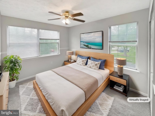 6502 Elk Ct, Waldorf, MD 20603 - carpeted bedroom with baseboards, multiple windows, and a ceiling fan