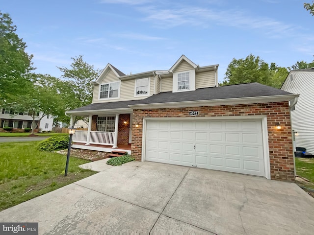 6502 Elk Ct, Waldorf, MD 20603 - view of front of home with brick siding, a porch, concrete driveway, and a garage