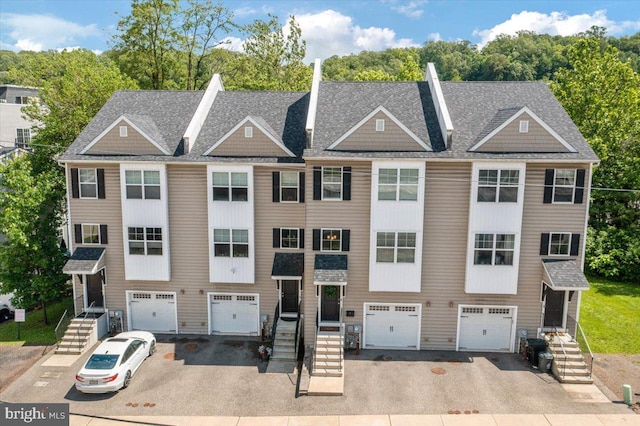 605 Apple St, Conshohocken, PA 19428 - view of front of house featuring an attached garage, driveway, and a shingled roof