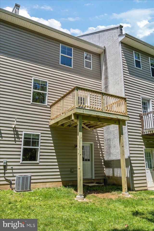 605 Apple St, Conshohocken, PA 19428 - back of property featuring a wooden deck, central AC, and a lawn