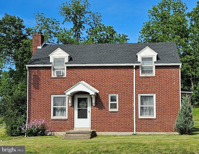 3209 E Harrisburg Pike, Middletown, PA 17057 - traditional-style home featuring a chimney, a front yard, brick siding, and cooling unit