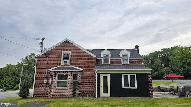 3209 E Harrisburg Pike, Middletown, PA 17057 - rear view of house with a chimney, a yard, brick siding, and a patio