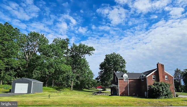 3209 E Harrisburg Pike, Middletown, PA 17057 - view of grassy yard with an outbuilding, a detached garage, and asphalt driveway