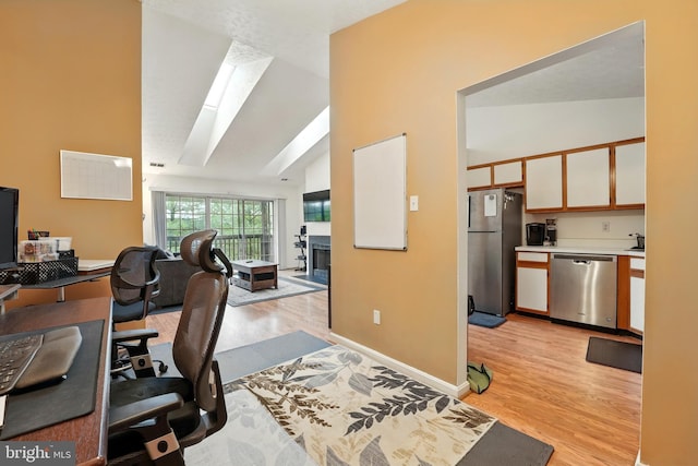 113 Timberlake Ter Unit 12, Stephens City, VA 22655 - office space featuring light wood-style flooring, high vaulted ceiling, a fireplace, a skylight, and baseboards