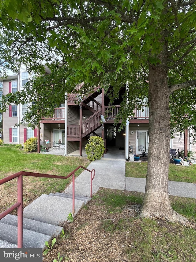 113 Timberlake Ter Unit 12, Stephens City, VA 22655 - view of side of property featuring a yard, stairway, and a deck