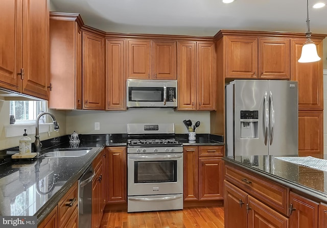 21143 Catnip Ct, Leonardtown, MD 20650 - kitchen featuring stainless steel appliances, a sink, brown cabinets, and recessed lighting