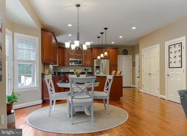 21143 Catnip Ct, Leonardtown, MD 20650 - dining area featuring a chandelier, baseboards, recessed lighting, and light wood-style flooring