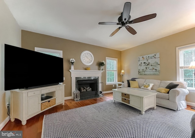 21143 Catnip Ct, Leonardtown, MD 20650 - living room featuring wood finished floors, ceiling fan, a fireplace, and baseboards